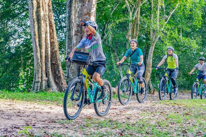Angkor Bike & Gondola Ride at Twilight - Angkor Thom at dusk: riding past rice fields, skipping some of the exit crush